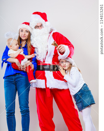 Mother, Santa and two daughters christmas family photo 114813261