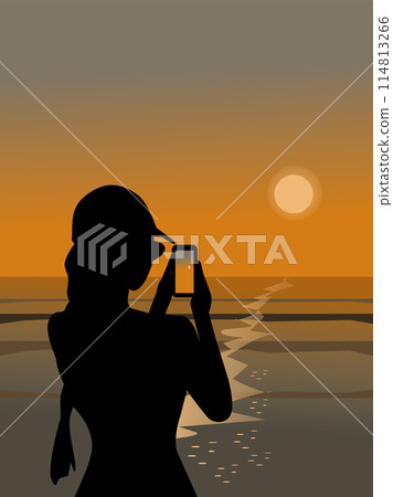 Silhouette of a woman using a mobile phone to take pictures of the sunset by the sea Silhouette of a woman using a mobile phone to take pictures of the sunset by the sea 114813266