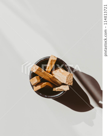 Wooden sticks Palo Santo in black box on light background. Aromatherapy and religious rites and meditations. 114813721