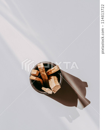 Wooden sticks Palo Santo in black box on light background. Aromatherapy and religious rites and meditations. 114813722