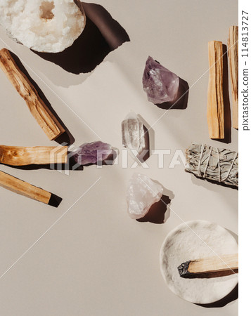 White sage and Palo Santo and amethyst and quartz crystals on a light beige background White sage and Palo Santo and amethyst and quartz crystals on a light beige background 114813727