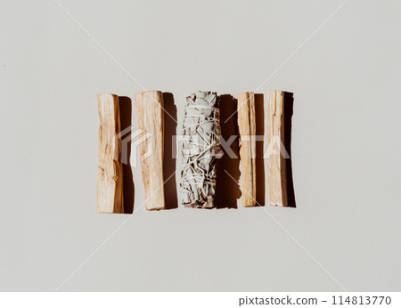 Wooden sticks Palo Santo and white sage on light background. 114813770