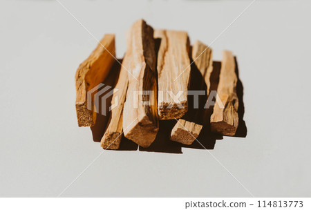Wooden sticks Palo Santo in a heap on light background Wooden sticks Palo Santo in a heap on light background 114813773