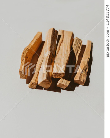 Wooden sticks Palo Santo in a heap on light background 114813774