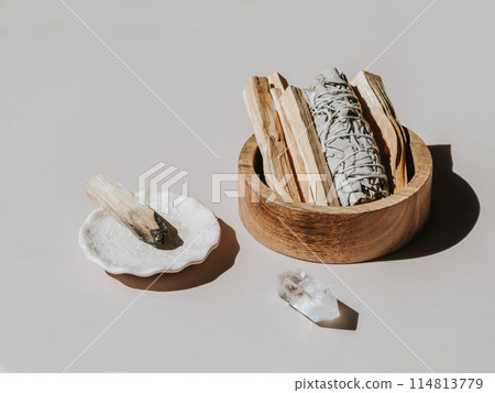 White sage and Palo Santo in wood box on a light background. White sage and Palo Santo in wood box on a light background. 114813779