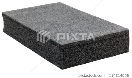 Black high-impact closed-cell polyethylene black foam brick isolated on white background. Specifically designed packing material. Black high-impact closed-cell polyethylene black foam brick isolated on white background. Specifically designed packing material. 114814006