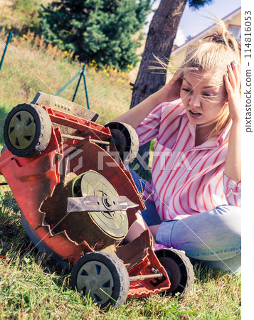 Person having problem with land mower 114816053