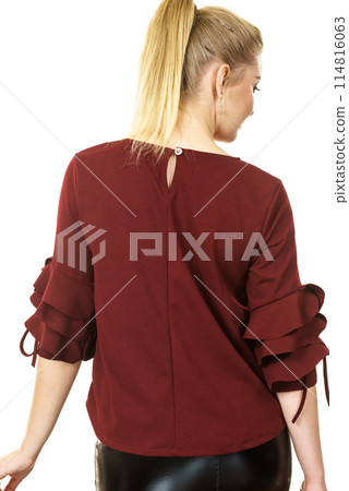 Woman wearing burgundy top 114816063