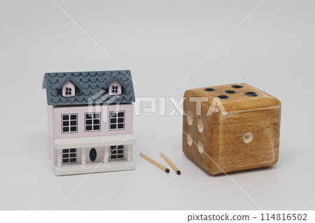 Homemade dice and matches next to a toy house, the concept of uncertainty, security and insurance, Homemade dice and matches next to a toy house, the concept of uncertainty, security and insurance, 114816502