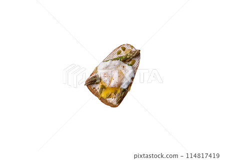 Delicious hearty breakfast consisting of poached eggs on toast with cream cheese, asparagus 114817419