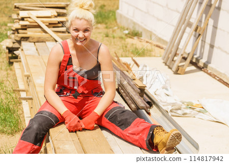 Woman taking break on construction site 114817942