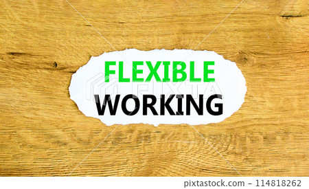 Flexible working symbol. Concept words Flexible working on beautiful white paper. Beautiful wooden wall background. Business flexible working concept. Copy space. 114818262