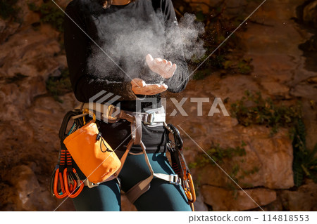 Girl is training, climbing in the mountains. 114818553