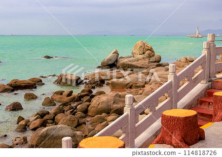 View of large rocks along the shore of the South China Sea. Sky Grottoes Park, Sanya, China View of large rocks along the shore of the South China Sea. Sky Grottoes Park, Sanya, China 114818726