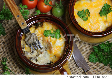 Julienne with chicken mushrooms and cheese. 114818838