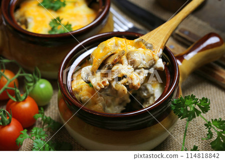 Julienne with chicken mushrooms and cheese. 114818842