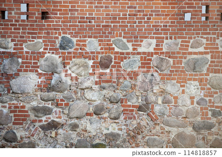 Vintage red brick wall with large white inserts and windows. The texture of the brick. Background. Horizontal. 114818857