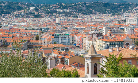 Bright sun lights red roofs of the old city timelapse. Aerial view from Shatto's hill. Nice, France Bright sun lights red roofs of the old city timelapse. Aerial view from Shatto's hill. Nice, France 114819335