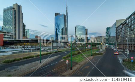 Milan skyline with modern skyscrapers in Porta Nuova business district day to night timelapse in Milan, Italy, after sunset. Milan skyline with modern skyscrapers in Porta Nuova business district day to night timelapse in Milan, Italy, after sunset. 114819418