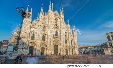 The Duomo cathedral timelapse hyperlapse at sunset. Front view with people walking on square 114819508