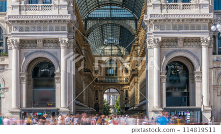 Entrance to the Galleria Vittorio Emanuele II timelapse on the Piazza del Duomo Cathedral Square . Entrance to the Galleria Vittorio Emanuele II timelapse on the Piazza del Duomo Cathedral Square . 114819511