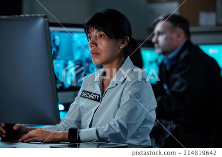 Looking at computer screen during work 114819642