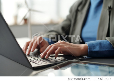 Manager touching keys of laptop keyboard 114819822