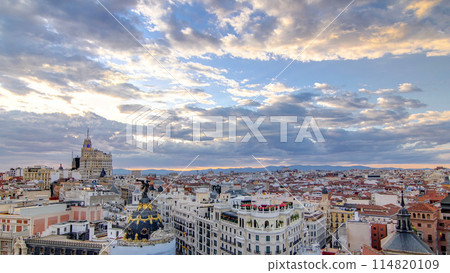 Panoramic aerial view of Gran Via timelapse before sunset, Skyline Old Town Cityscape, Metropolis Building, capital of Spain Panoramic aerial view of Gran Via timelapse before sunset, Skyline Old Town Cityscape, Metropolis Building, capital of Spain 114820109