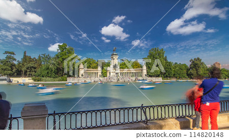 Tourists on boats at Monument to Alfonso XII timelapse hyperlapse in the Park of the Pleasant Retreat in Madrid, Spain Tourists on boats at Monument to Alfonso XII timelapse hyperlapse in the Park of the Pleasant Retreat in Madrid, Spain 114820148
