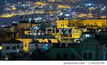 Skyline of the Old City in Jerusalem with historic buildings aerial night timelapse, Israel. Skyline of the Old City in Jerusalem with historic buildings aerial night timelapse, Israel. 114820246
