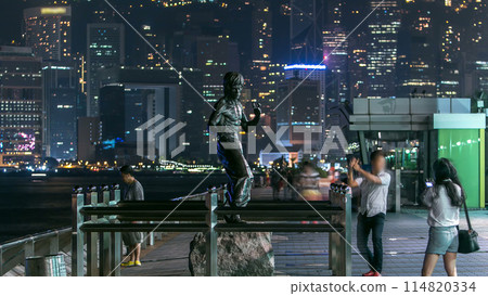 Bruce Lee monument timelapse in the night at the Avenue of stars, in Hong Kong. Bruce Lee monument timelapse in the night at the Avenue of stars, in Hong Kong. 114820334
