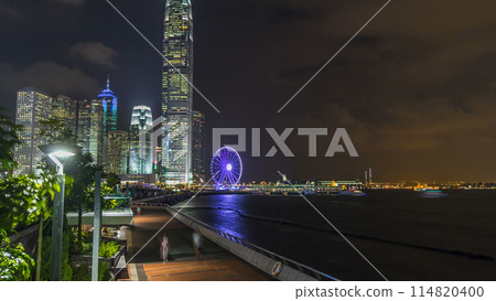 Skyscrapers night timelapse and Hong Kong Observation Wheel, which is the latest tourist attraction in the city. Skyscrapers night timelapse and Hong Kong Observation Wheel, which is the latest tourist attraction in the city. 114820400