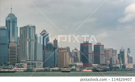 Hong Kong skyline in the morning over Victoria Harbor timelapse. 114820407