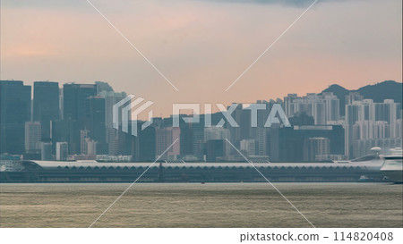 Hong Kong skyline in the morning over Victoria Harbour timelapse. 114820408