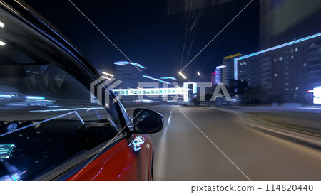 Drivelapse urban look from fast driving car at a night avenue in a city timelapse hyperlapse Drivelapse urban look from fast driving car at a night avenue in a city timelapse hyperlapse 114820440