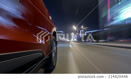 Drivelapse urban look from fast driving car at a night avenue in a city timelapse hyperlapse 114820446