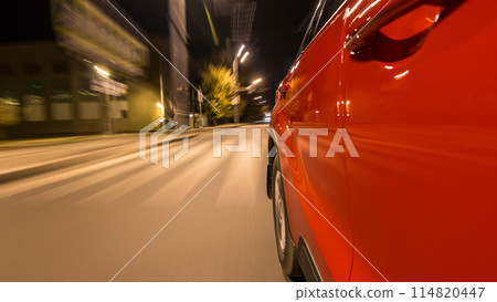 Drivelapse from side of car moving on a night avenue in city timelapse hyperlapse 114820447