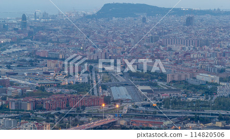 Barcelona and Badalona skyline with roofs of houses and sea on the horizon day to night timelapse 114820506