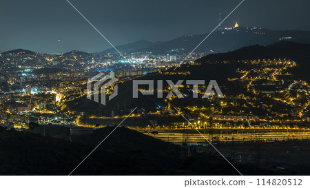 Barcelona and Badalona skyline with roofs of houses and sea on the horizon night timelapse Barcelona and Badalona skyline with roofs of houses and sea on the horizon night timelapse 114820512