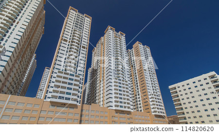 Modern new towers in Ajman timelapse hyperlapse. Cityscape of Ajman. Modern new towers in Ajman timelapse hyperlapse. Cityscape of Ajman. 114820620