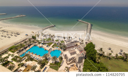 Beautiful area of beach in Ajman timelapse near the turquoise waters of Arabian Gulf. Beautiful area of beach in Ajman timelapse near the turquoise waters of Arabian Gulf. 114820705