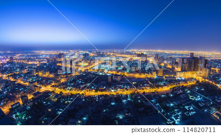 Cityscape of Ajman from rooftop night to day timelapse. Ajman is the capital of the emirate of Ajman in the United Arab Emirates. 114820711