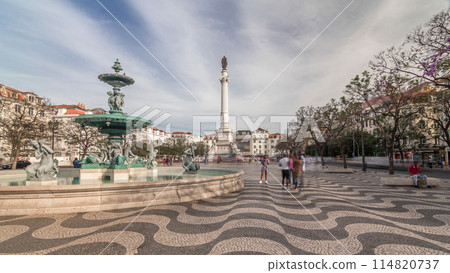 Rossio square with fountain and monument on column located at Baixa district timelapse hyperlapse in Lisbon, Portugal 114820737