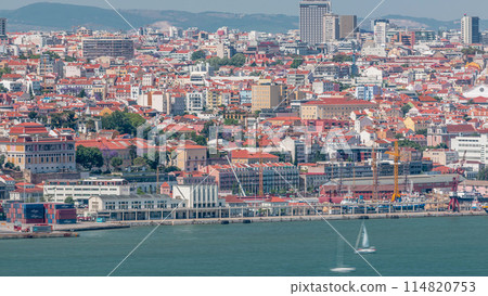 Panorama of Lisbon historical centre aerial timelapse viewed from above the southern margin of the Tagus or Tejo River. 114820753