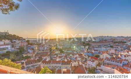 Lisbon at sunset aerial panorama of city centre with red roofs at Autumn evening timelapse, Portugal Lisbon at sunset aerial panorama of city centre with red roofs at Autumn evening timelapse, Portugal 114820784