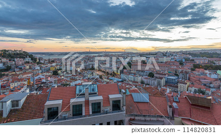 Lisbon after sunset aerial panorama view of city centre with red roofs at Autumn day to night timelapse, Portugal 114820831