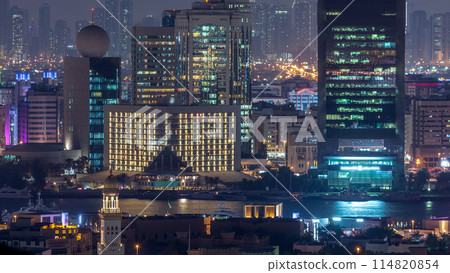 Aerial view of neighborhood Deira with typical buildings night timelapse, Dubai, United Arab Emirates 114820854