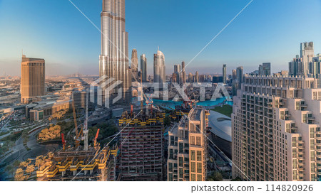 Panoramic skyline view of Dubai downtown with mall, fountains and skyscrapers aerial timelapse Panoramic skyline view of Dubai downtown with mall, fountains and skyscrapers aerial timelapse 114820926