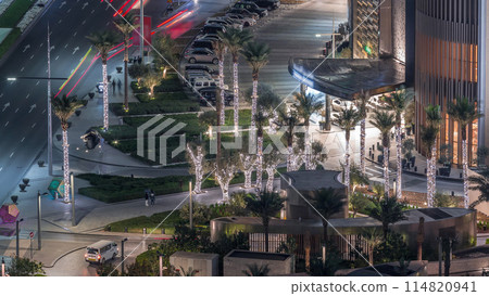 Aerial view of shopping mall with road traffic night timelapse Aerial view of shopping mall with road traffic night timelapse 114820941
