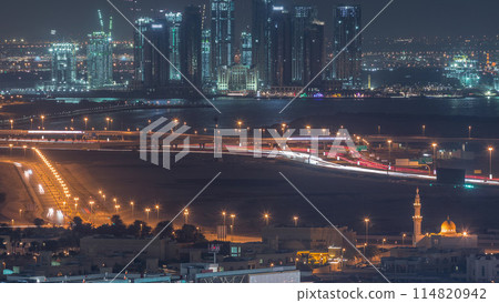 Construction of new skyscrapers in Dubai Creek Harbor aerial night timelapse. Dubai - UAE. Construction of new skyscrapers in Dubai Creek Harbor aerial night timelapse. Dubai - UAE. 114820942